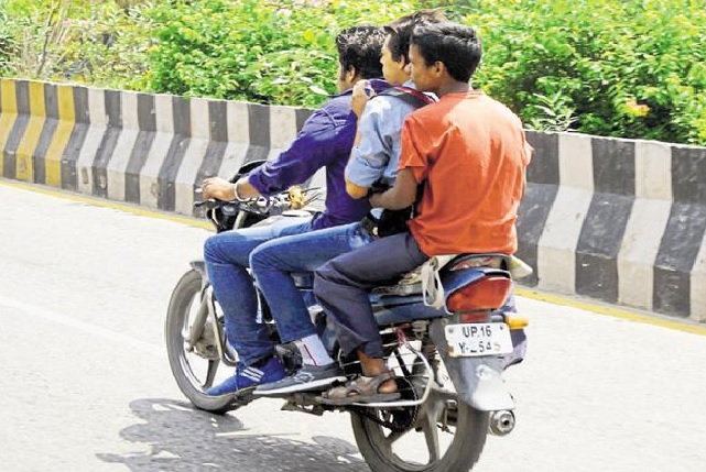 UP doubles penalty for using mobile phones while driving, riding two wheelers without helmet