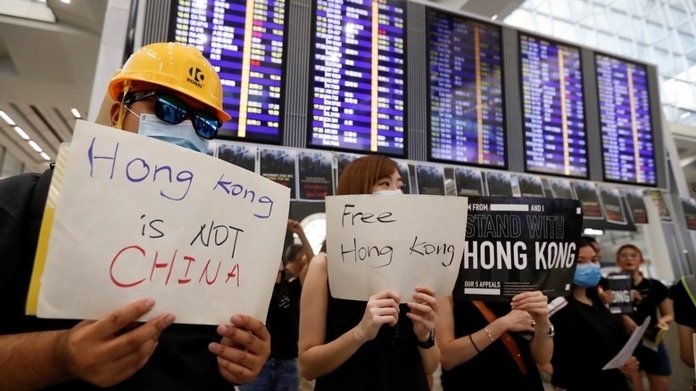 Stranded passengers at airport voice support for Hong Kong protesters