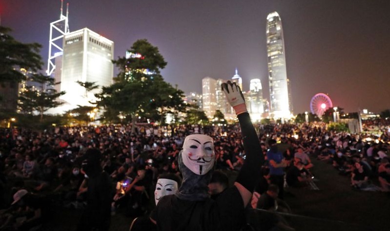 Thousands march as Hong Kong government mulls face mask ban