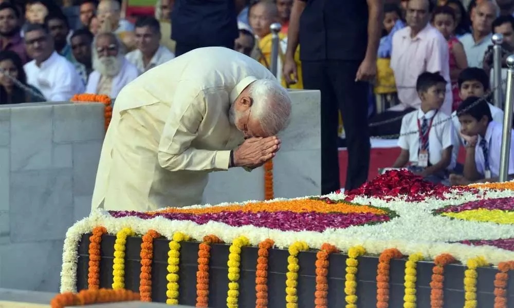 President Ram Nath Kovind and PM Narendra Modi pay tributes to Mahatma Gandhi on his 150th birth anniversary at Rajghat