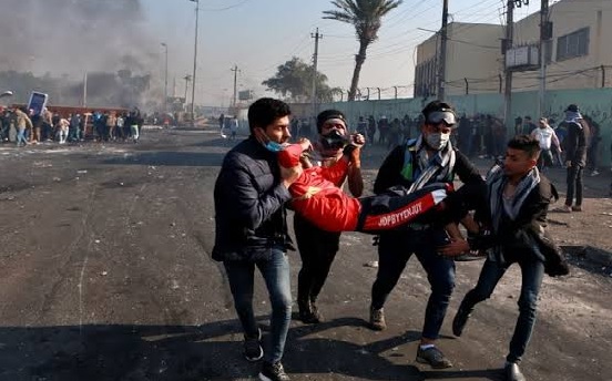 Iraq officials 9 wounded, protesters take a Baghdad highway