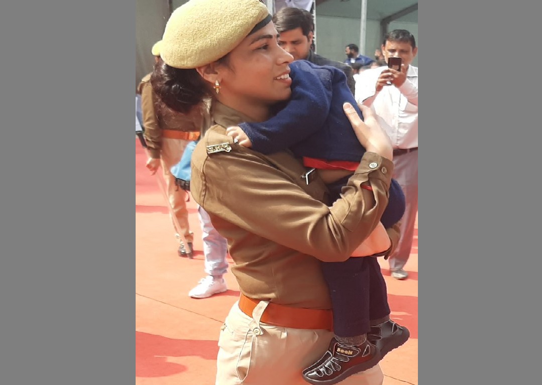 At Yogi's event: Cop on duty with infant son in her arms