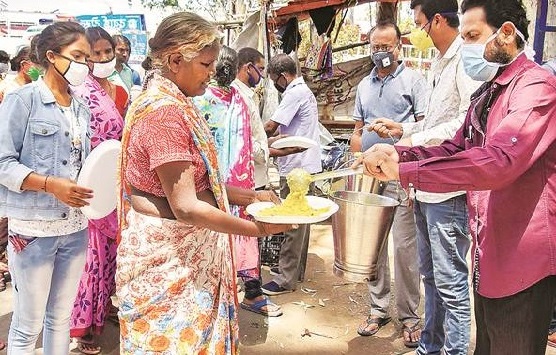 NGOs, politicos distribute essential items in slum areas